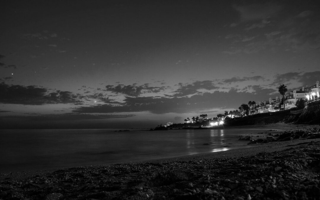 House near beach with bright lights affecting others